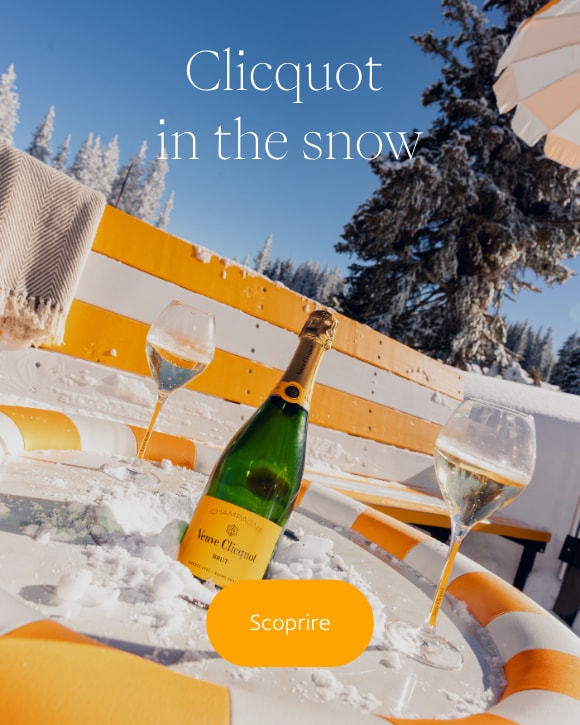 Veuve Clicquot Bottle of Brut Yellow Label with two glasses at Sun Club Aspen in the snow